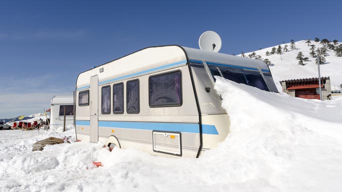 Winterizing RV travel trailer stuck in the snow