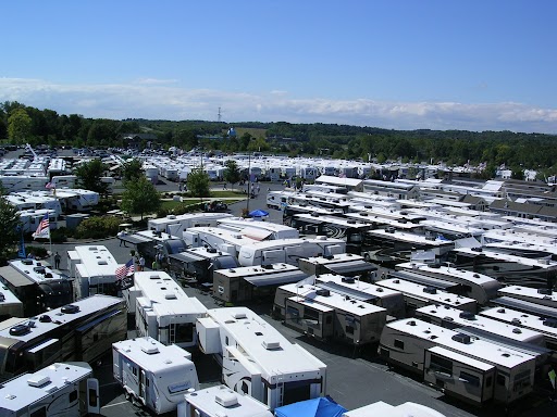 Motorhomes and travel trailers parked at event covered by an Extended RV Warranty